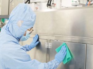 A person is cleaning a surface with Sahara Sponge
